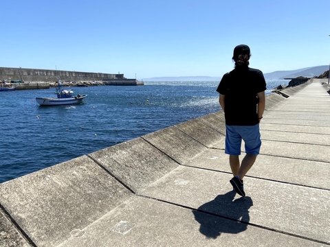 A picture of myself from behind walking through a port