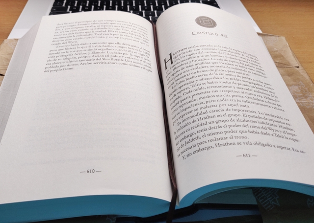 The Elantris book openend in page 610 over my laptop in my parent&rsquo;s house desktop