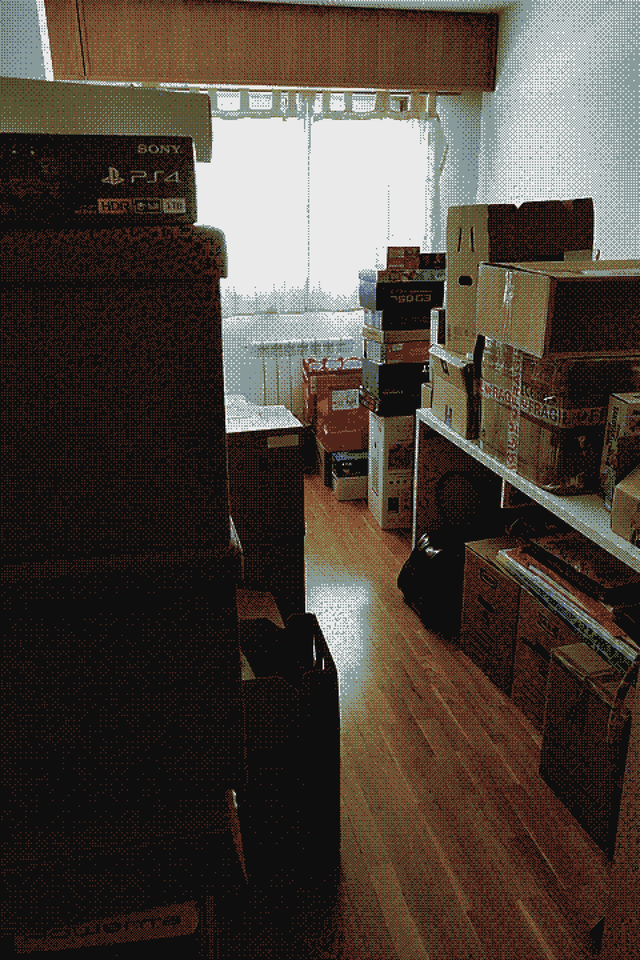 A picture of a room in my house right now, full of boxes because we&rsquo;re moving to a new flat.